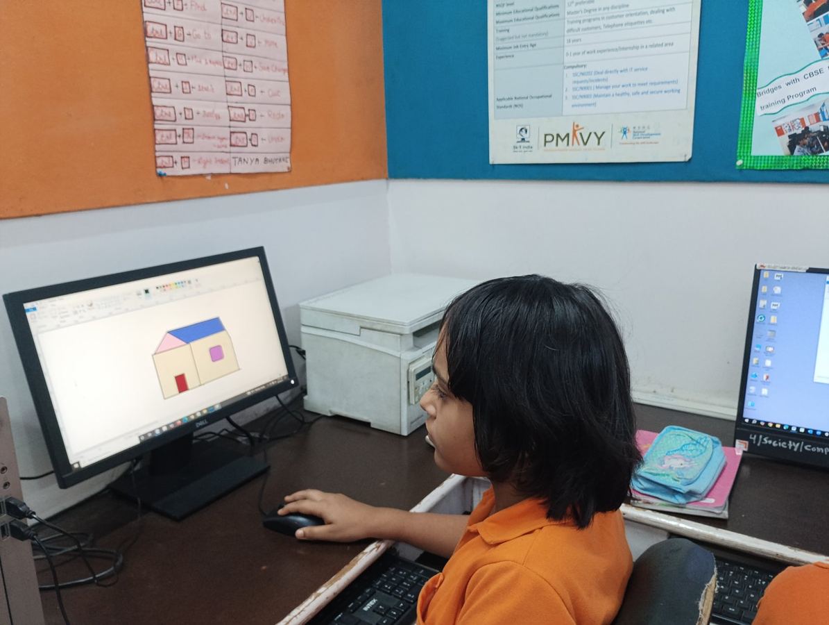 A learner drawing a house on screen at the ACE Lab